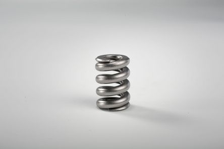 Compression spring with external chamfer